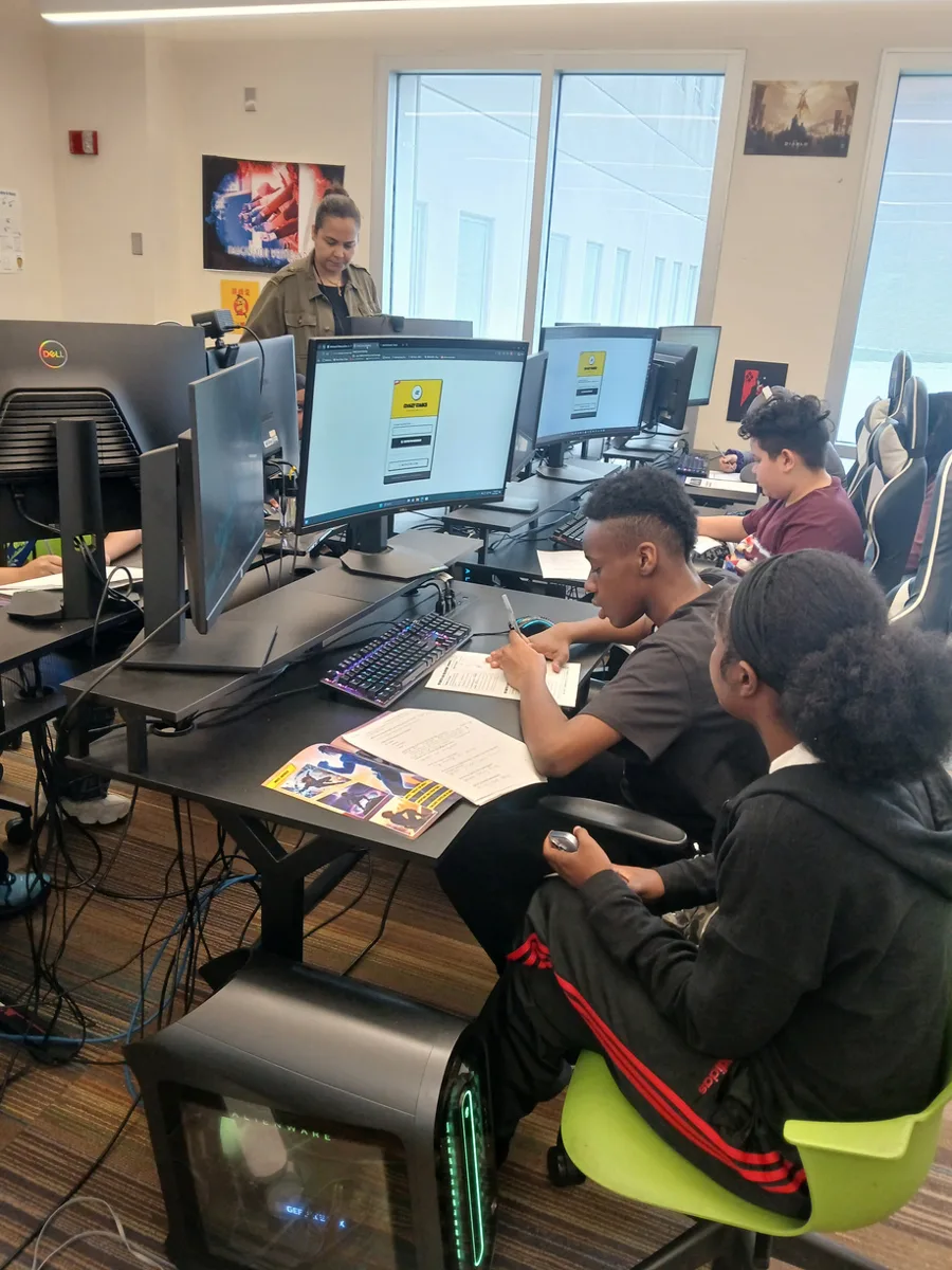 Students creating at computers in the library's Digital Media Lab